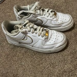 White Air Force 1s with gold trim
